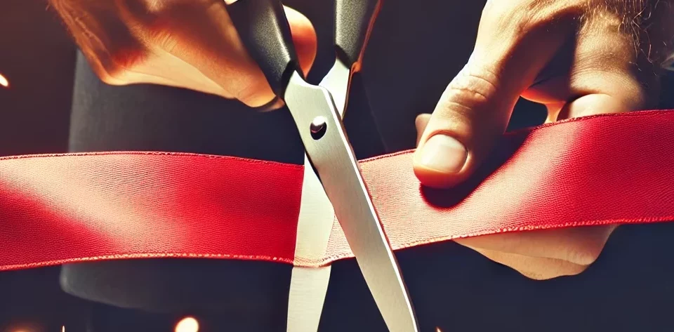 Scissors cutting through a red tape symbolises regulatory simplification.